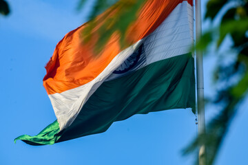 India flag flying high at Connaught Place with pride in blue sky, India flag fluttering, Indian...