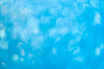 Abstract blurred background. Defocused portrait lens back. Backdrop bokeh. Vivid blue.