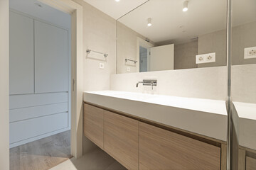 modern design bathroom with mirror with fine integrated wall and marble type tiles