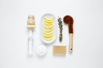 Eco friendly cleaning concept. Brushes made from natural materials, soda, soap, vinegar, lemon for cleaning and washing house. Top view, flatlay