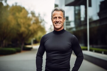 Portrait of a happy man in his 50s showing off a lightweight base layer against a sophisticated corporate office background. AI Generation