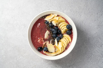 Berry smoothie bowl, fresh blueberry, raspberry, strawberry smoothie with banana and chia seeds