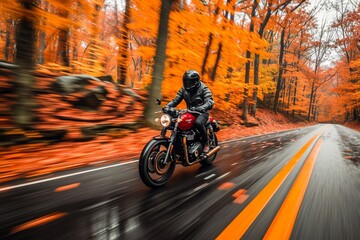 A motorcyclist rides through a vibrant autumn forest, showcasing the beauty and thrill of an autumn road trip.