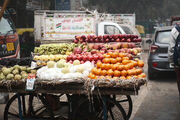 Fruits seller cart at the street market in Delhi, India