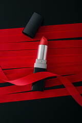 Red lipstick on ribbon background