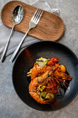 Grilled tiger prawns with sweet and sour sauce on plate