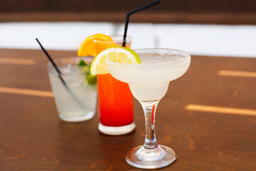 Cocktail glasses on wooden background