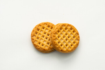 Cream sandwich cookies, baked biscuits stuffed with milk cream isolated on white background