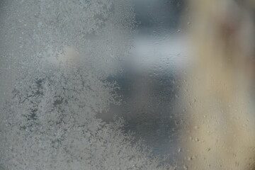 Frosty patterns on glass. Close view