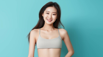 Asian woman in sports bra isolated on background.