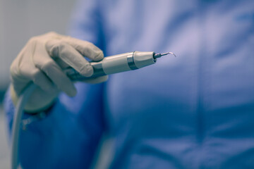 Close up on dentist tools, background is blurred and depth of field is shallow.