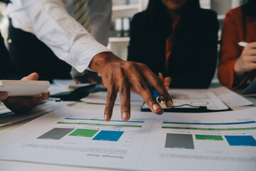 Business team working with new startup project plan and discussion information for financial strategy with laptop and digital tablet in a modern business lounge.