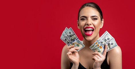 Girl holding cash money in dollar banknotes. Woman holding lots of money in dollar currency....