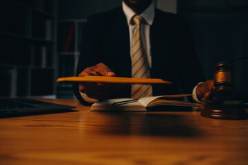 Judge gavel with Justice lawyers having team meeting at law firm background. Concepts of Law and...