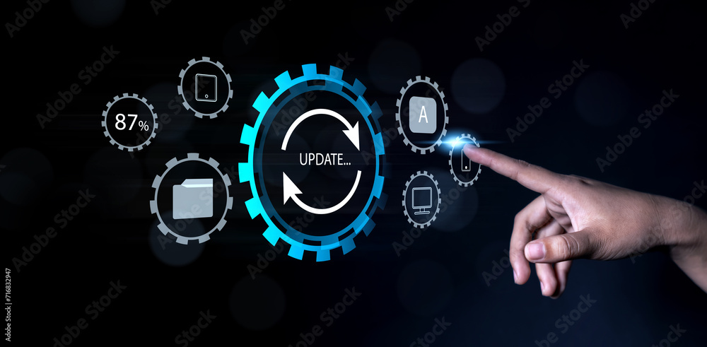 Fototapete Updating computer system software application installation for devices to be up to date with the new version. Hand interacting with graphics icon updating function screen loading on computer laptop.