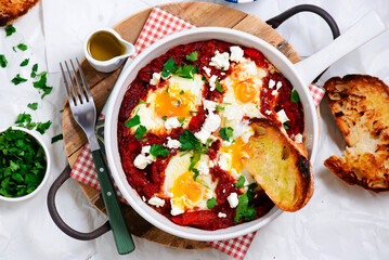 Shakshukka with feta and bread.traditional moroccan dish. selective focus. hugge style