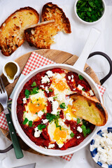 Shakshukka with feta and bread.traditional moroccan dish. selective focus. hugge style
