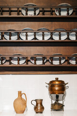 antique tableware at home in Istanbul. an open cupboard for dining utensils in the kitchen in Turkey. the texture of the shelves with plates
