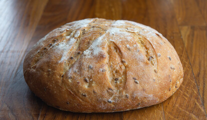 Round bread. Round bread on a wooden table close-up