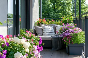 Fotobehang Modern large balcony is decorated with flowers. Reading and relaxing area at home © Kien