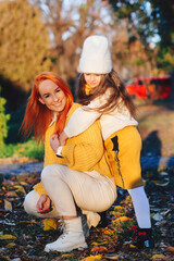 Lovely family laughing on autumn walk. Autumn holidays, lifestyle.