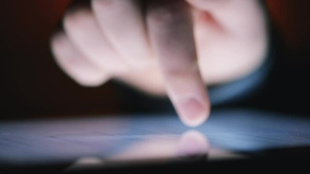 Phone, finger scrolling on screen for information or research closeup in studio on dark background. Hands, contact and app on display with person using internet on mobile for reading or communication