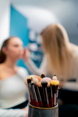 close-up of many different brushes of a makeup artist for applying cosmetics in a beauty salon