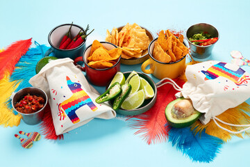 Cinco de mayo party food. Mexican holiday traditional dishes, snacks, tortilla corn chips, nachos, tacos, salsa, sauces.