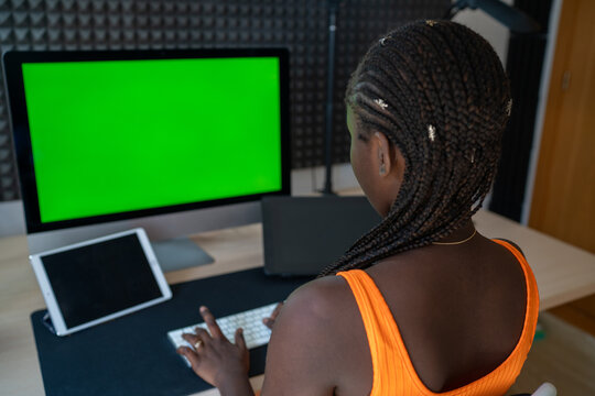 Black woman working with computer in workspace