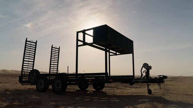 Auto transporting trailer in the desert