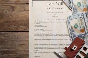 Last Will and Testament, dollar bills, house model and pen on wooden table, flat lay. Space for text