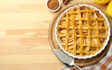 Tasty homemade quince pie on wooden table, flat lay. Space for text