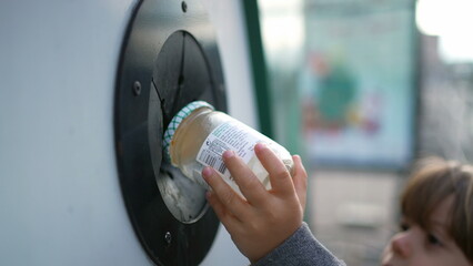Eco-Conscious Child Recycling Glass, Green Initiative in Action, Child's Contribution to the...