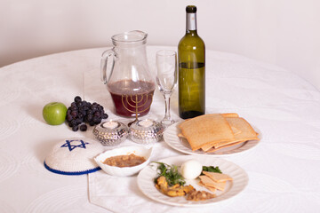 Elegant Passover Table Setting: Wine, Grape Juice, Matzah, and Traditional Elements