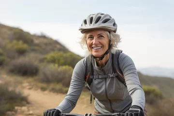 Wandcirkels aluminium Portrait of a relaxed mature woman practicing mountain biking. With generative AI technology © Markus Schröder