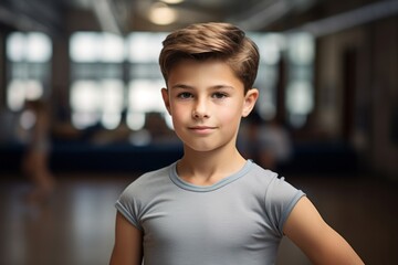 Portrait of a handsome kid male practicing ballet in a studio. With generative AI technology