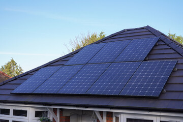 photovoltaic solar cells on roof of house. clean and renewable energy source. solar power 
