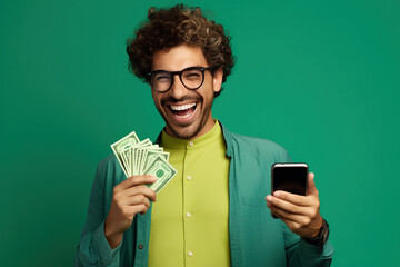 Portrait of overjoyed impressed person wear stylish t-shirt eyewear holding smartphone win betting isolated on green color background - obrazy, fototapety, plakaty