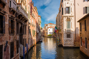 Fototapeta na wymiar Canal and old buildings in Venice, Italy 