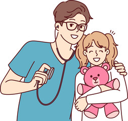 Man pediatrician hugs little girl with toy before examination and holds stethoscope