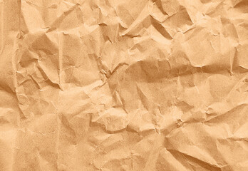 close up texture of brown crumpled or torn old craft paper use as background with blank space for...