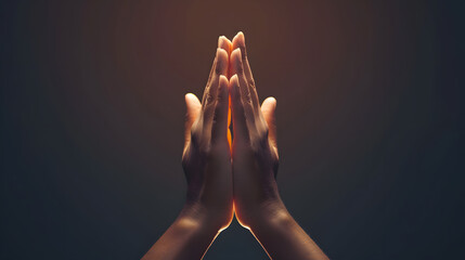 Praying hands with faith in religion and belief in God on dark background. Power of hope or love and devotion. Namaste or Namaskar hands gesture.