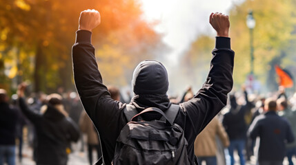 Protester raising hands during demonstration in the street - obrazy, fototapety, plakaty
