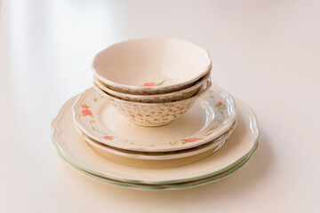 Closeup of porcelain plates and bowls