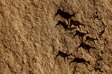 Cave art seamless pattern made of ancient wild animals, horses and hunters. Rock paintings. Hunting...