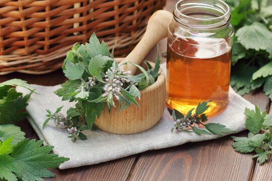 Rosehip tea with fresh red dog-rose berries on wooden table, closeup, copy space, vitamin supplement drink, face skin care, beauty healthy treatment concept