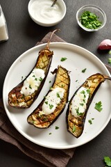 Baked aubergine with garlic yogurt dressing