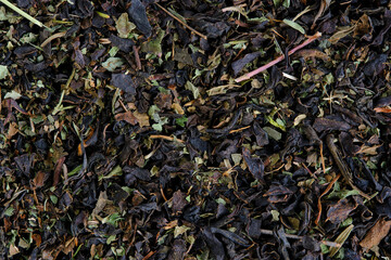 Background, black tea with thyme and melissa.