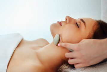 Obraz na płótnie Canvas Woman during skin care procedure in spa salon