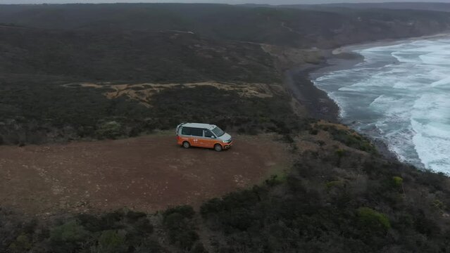 Aerial video of a vehicle on a cliff in Alentejo coast of Portugal 